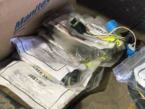 lot 277 image: Lot of (5) Hiniker Assorted Snow Plow Headlight Adapters (in original packaging)