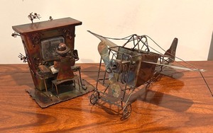 lot 78 image: Vintage Brutalist Style Biplane and Piano Man Metal Music Boxes