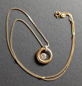 lot 25 image: 14k Yellow Gold Circle Diamond Pendant and Chain