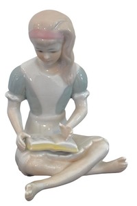 lot 120 image: Vintage Cybis Porcelain Figurine of Alice from Alice in Wonderland Engrossed in Reading a Book