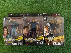 lot 55 image: WWE Roddy Piper, John Cena & Stacy Keibler