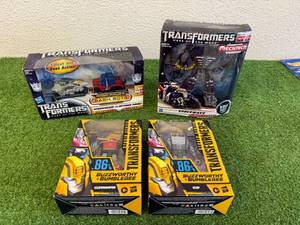 lot 131 image: Transformers - Shockwave, Starscream vs Optimus Prime, Cliffjumper & Kup