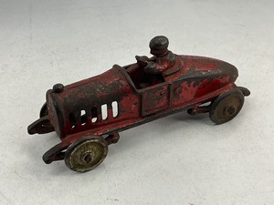 lot 20 image: A.C. Williams Cast Iron Boat Tail Toy Race Car- Red