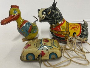lot 49 image: Lot of 3 Vintage Tin Lithograph Wind Up Toys Wee Scottie, Duck and Ambulance