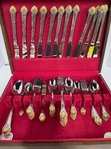 lot 55 image: Reed and Barton Stainless Gold Golden Seafare Flatware 64 PC Set