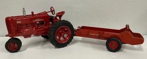 lot 107 image: McCormick  Farmall 400 and McCormick Deering Speader Die Cast Metal