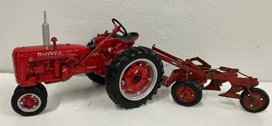 lot 115 image: McCormick Farmall Die Cast Tractor and Plow