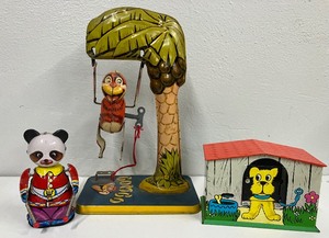 lot 142 image: 1940s Bombo Swinging Money, Panda and Dog House Tin Litho Wind Up Toys