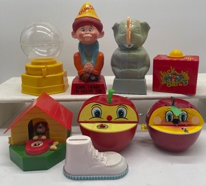 lot 162 image: Lot of Vintage Banks Toy Banks Plastic Dunce Hat Bank, Apple, Dog House