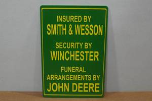 lot 103 image: Novelty Metal Sign - Smith & Wesson