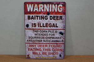 lot 104 image: Novelty Metal Sign - Warning Baiting Deer is Illegal
