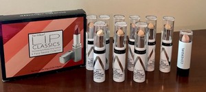 lot 106 image: Lot of 10 Almay Skin Perfecting Comfort Concealers and Fan Wilson Lip Classics Set