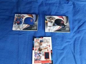 lot 99 image: 2 Helmet 1 Jersey Cards