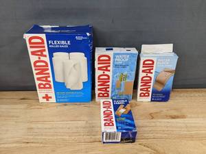 lot 112 image: 4 Boxes of Band-Aid First Aid Gauze, Strips, and Bandages - Brand New