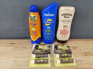lot 294 image: Banana Boat Sport Ultra, Coppertone Sport SPF 70, Hawaiian Tropic Sheer Touch, and 4 Sun Bum Coconut Lip Balm - Brand New