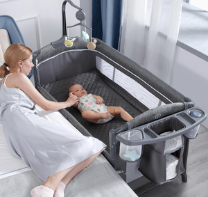 lot 282 image: BabyBond Baby Bassinet Bedside Crib, Pack and Play with Sheet, Diaper Changing Table and Music Mobile