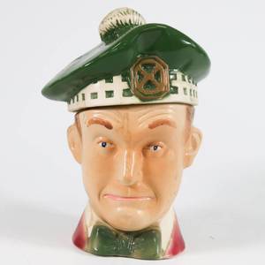 lot 27 image: Vintage 1976 Heritage Ezra Brooks Stan Laurel Decanter