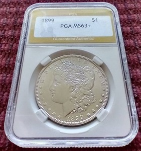 lot 71 image: Tough Date 1899 Morgan Dollar - PGA MS63