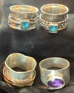 lot 42 image: Four Wide Band Sterling Silver Rings