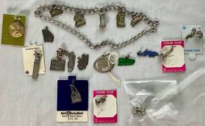 lot 41 image: Vintage Charm Bracelet with 19 Sterling Silver Charms