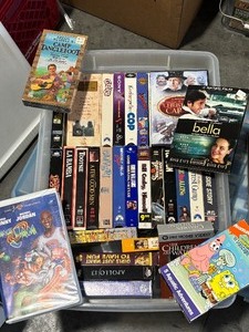 lot 14 image: Variety of VHS and DVDs in Tote
