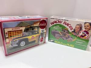 lot 36 image: Two New Sealed Models Compact Pussy Cat and 1941 Plymouth
