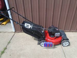 Yard Machine 21” self propelled lawn mower with bagger. Looks nearly new. As shown.