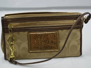 lot 4 image: Coach Poppy Signature Wristlet Beige and Brown
