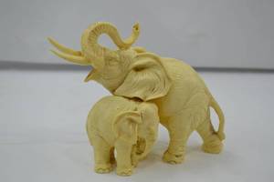 lot 9 image: Ivory-Toned Elephant Figurine Pair - Home Decor Accent