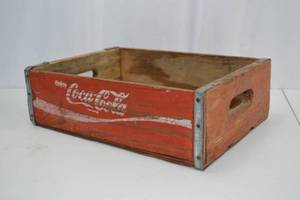 lot 105 image: Vintage Wooden Coca-Cola Crate with Red Paint and Metal Reinforcement