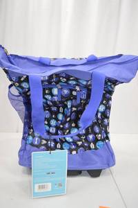 lot 134 image: Olympia Lifesaver Deluxe Rolling Shopper Tote, Purple Circles, 20 Inch