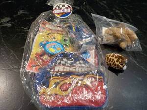 lot 62 image: Racing Backpack and Toys...