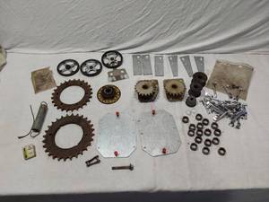 lot 185 image: Mixed Mechanical Parts Lot including Gears, Springs, and Hubs