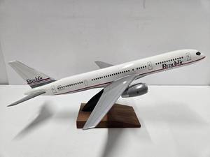 lot 95 image: Larger Mint in Box Wooden REPUBLIC AIRLINES Airplane Model wStand