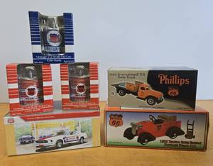 lot 226 image: Great Lot of Mint in Box PHILLIPS 66 Diecast Metal Trucks & Oil Can Banks