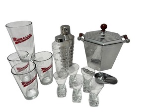 lot 46 image: Barware Collection with Reed & Barton Ice Bucket, Shakers, Minnesota Twins Glasses, and Shot Glasses