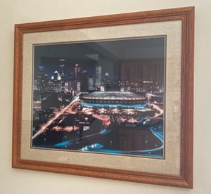 lot 71 image: Framed Nighttime Cityscape of Metrodome Stadium