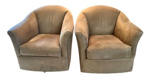 lot 21 image: Pair of Precedent Barrel-Back Swivel Armchairs in Brown Upholstery