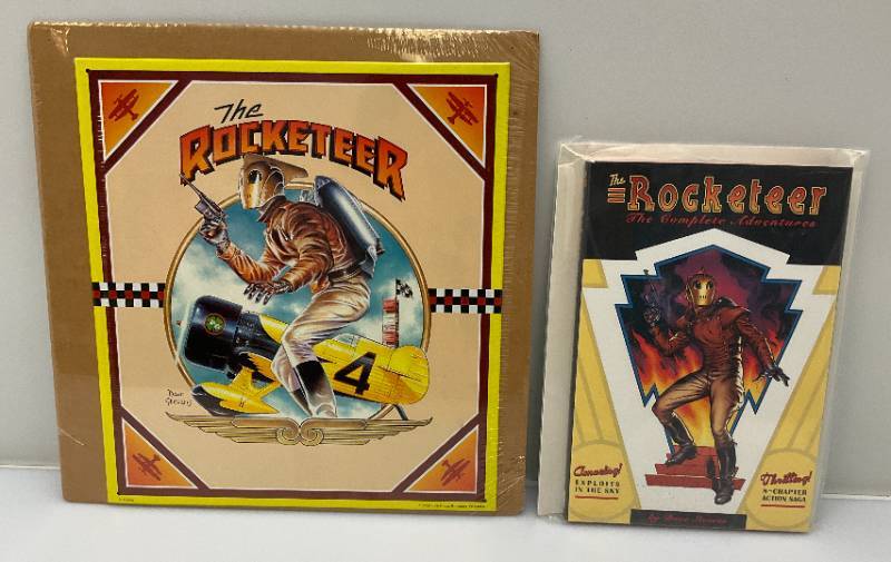 lot 6 image: THE ROCKETEER The Complete Collection The Complete Adventures By Dave Stevens & Tin Sign 11 34 x 13