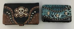 lot 56 image: Two Collectible Skull Adorned Womans Clutch Bags One Has Strap