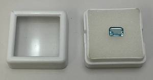 lot 234 image: Lab Created 1.17 CT Sky Blue Topaz Emerald Cut (In Protective Case)