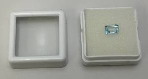 lot 236 image: Lab Created 1.17 CT Sky Blue Topaz Emerald Cut (In Protective Case)