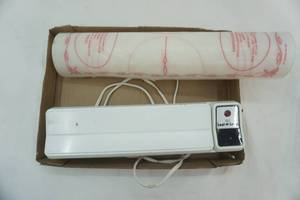 lot 192 image: Sears Electric Seal and Save, Tupperware Rolling Pin and Mat