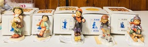 lot 37 image: Vintage Hummels including Ride into Christmas, Peaceful Offering, Skier, Merry Wanderer and Lost Sheep