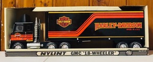 lot 38 image: Vintage NYLINT GMC 18 Wheeler Harley Davidson