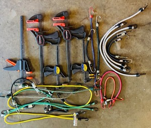 lot 112 image: Variety of Sized Bungies, Quick - Grip Clamps and Craftsman Bar Clamp