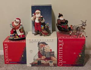 lot 64 image: Four Clothique Santa Figurines