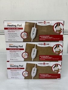 lot 105 image: Lot of 3 NEW Thera Care Deluxe Heating Pads  MoistDry Therapy 4 heat settings, 2-hr auto shut-off, push-button controller, and ultra-soft machine-washable micro-plush cover. Perfect for soothing sore muscles, joints, and all-day comfort.