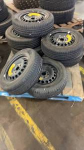 lot 320 image: Set of 7 Bridgestone T13580D16 and 19565R15 Spare Tires with Steel Rims