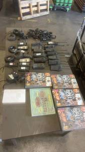 lot 661 image: Lot of 8 Two-Way Radios with Chargers, Accessories, and Assorted Bibles